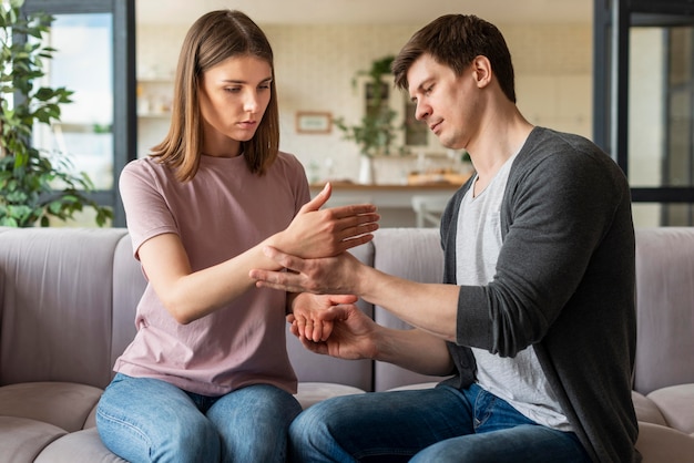 Couple talking using sign language