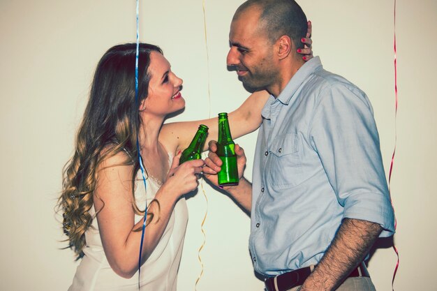 Free photo couple toasting with beer