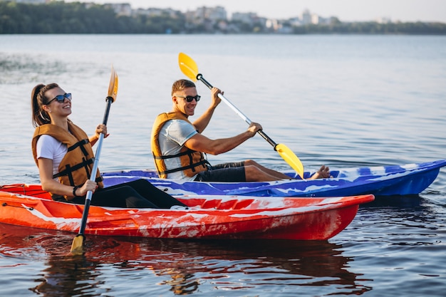 Couple together kayaking on the river