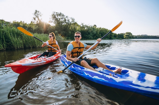 Couple together kayaking on the river