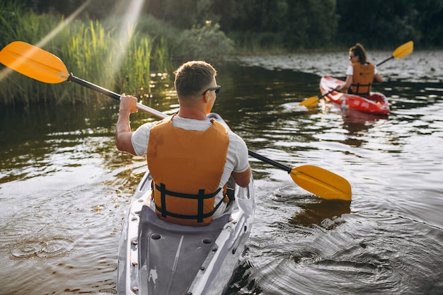 Couple together kayaking on the river