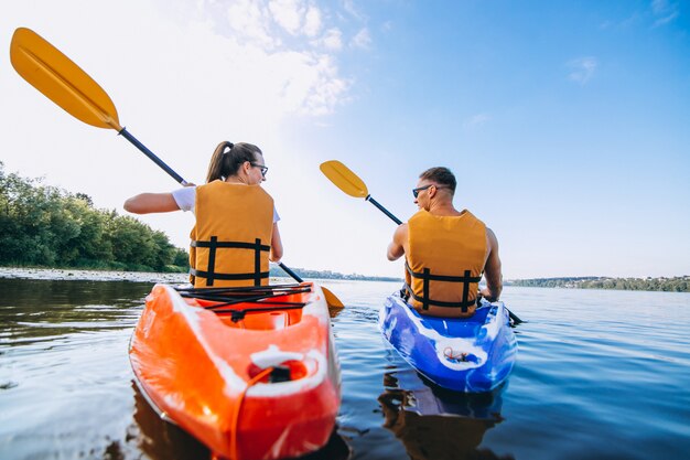 Couple together kayaking on the river