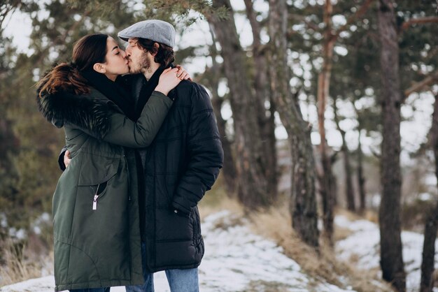 Couple together in winter park having fun