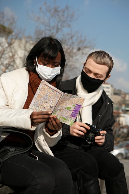 Couple of tourists checking a map