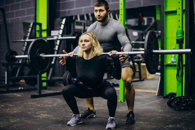 Couple training together at the gym