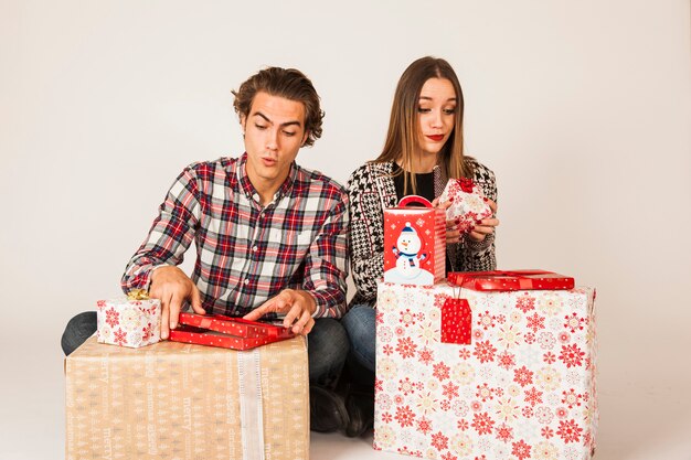 Couple unpacking presents