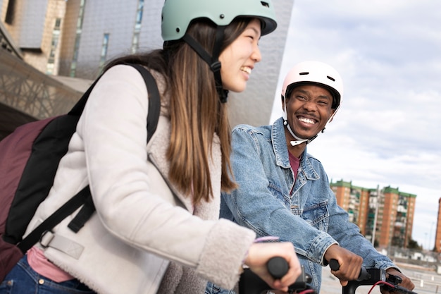 Couple using electric scooter for transportation