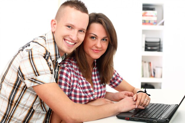 couple using laptop together