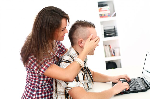 couple using laptop together