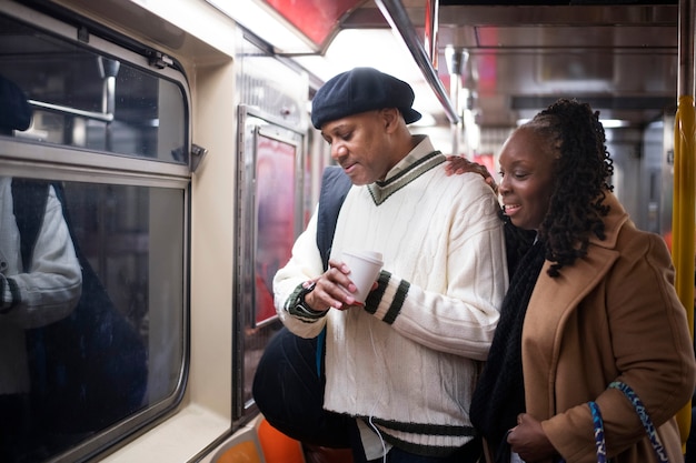 Couple using technology while traveling in the city