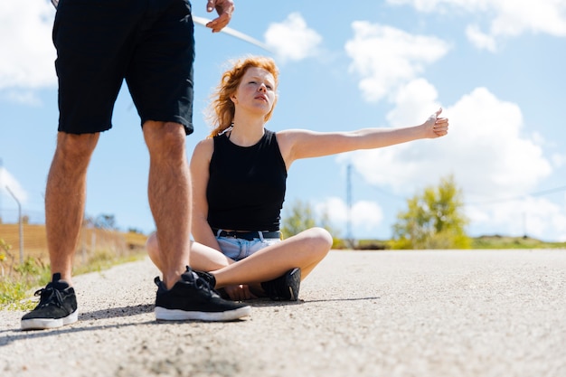 Couple waiting for ride on road