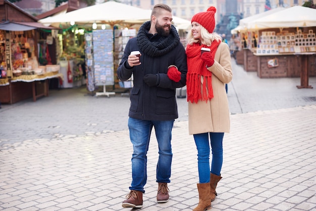 Couple walking around the christmas market
