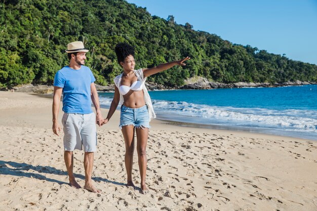 Couple walking at the beach