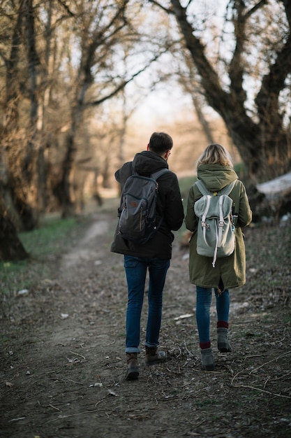 Free photo couple walking in the woods