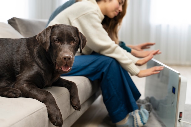 Free photo couple warming up with heater at home