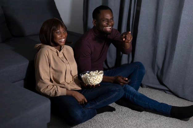 Couple watching streaming service together at home