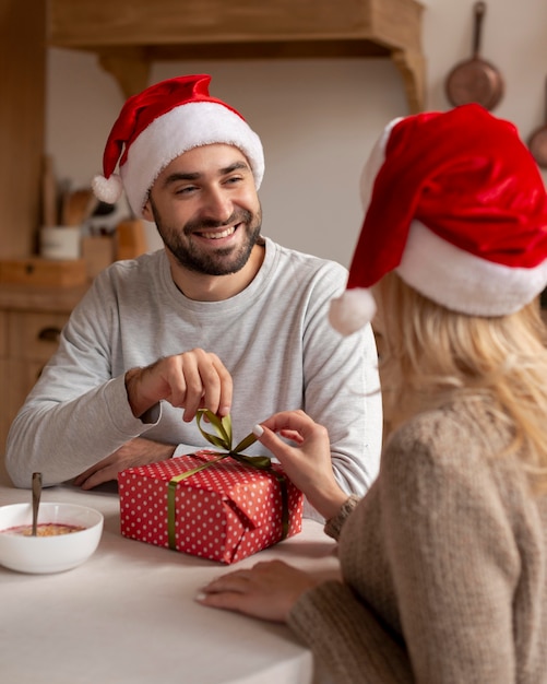 Couple wearing christmas hats