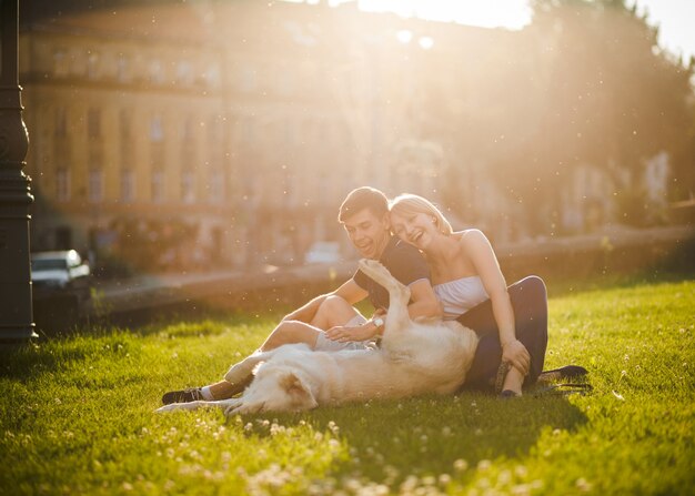  couple with dog having fun