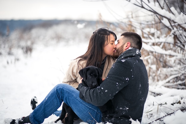 Couple with dog in winter