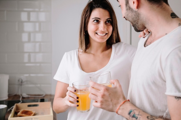 Couple with juice looking at each other