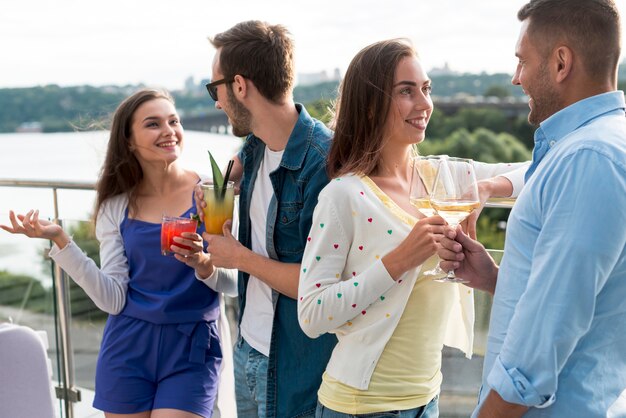 Couples discussing at a terrace party