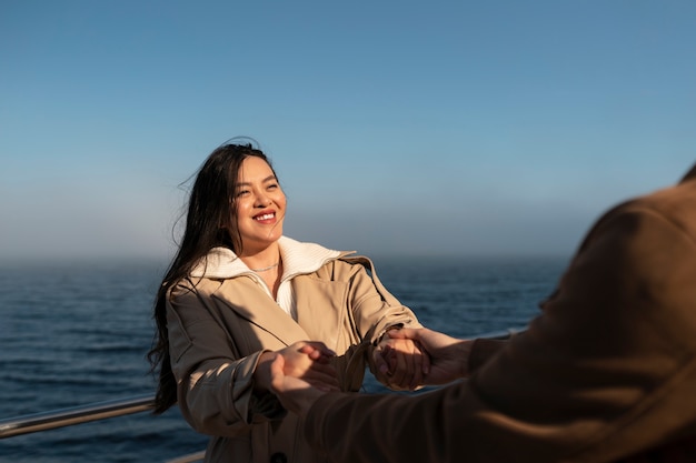 Free Photo couples embracing near the sea