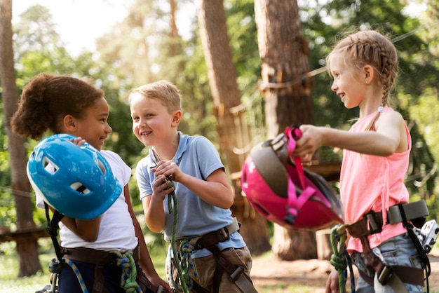 Free photo courageous children having fun at an adventure park