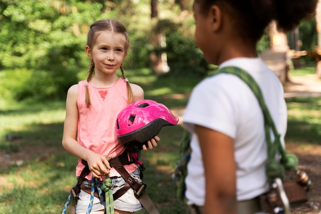 Courageous children having fun at an adventure park