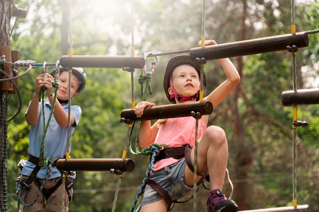 Free photo courageous kids having fun at an adventure park