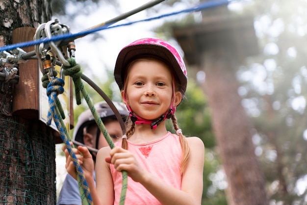 Free photo courageous kids having fun at an adventure park