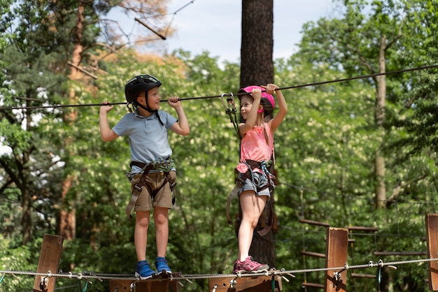 Free photo courageous kids having fun at an adventure park