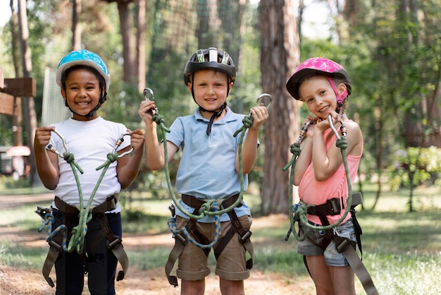 Free photo courageous kids playing in an adventure park