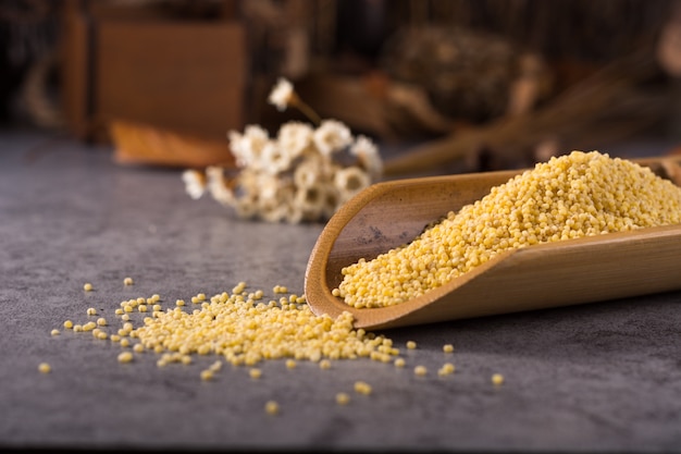 Couscous in a wooden spoon