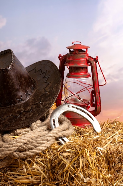 Free photo cowboy hat and lamp arrangement