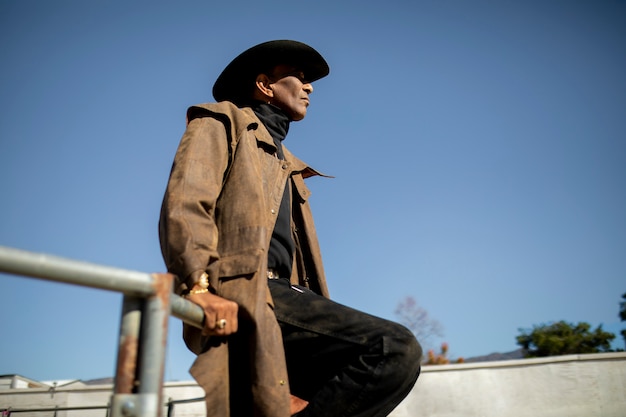 Free Photo cowboy silhouette against warm light