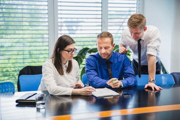 Coworkers brainstorming in office