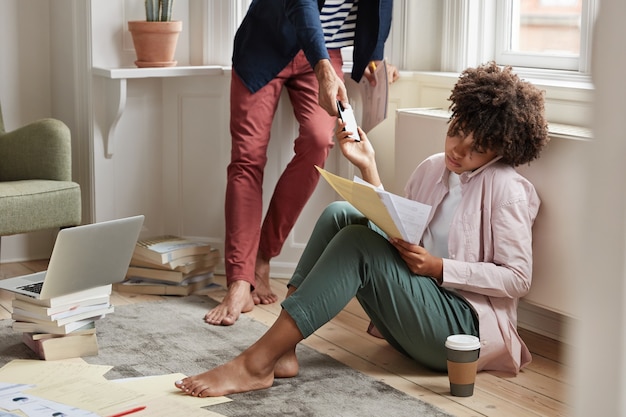 coworkers working problems during mobile conversation