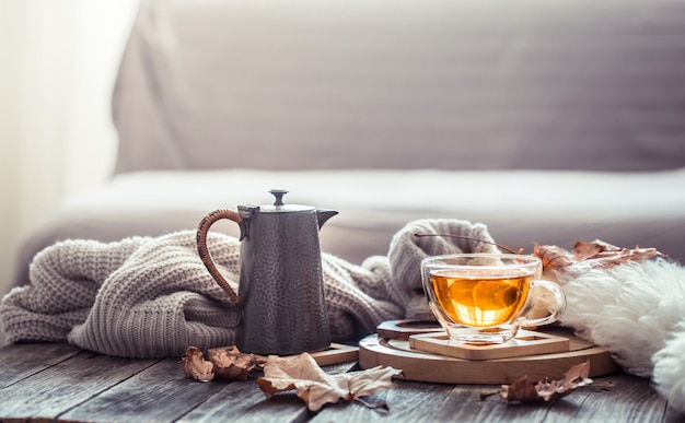 Cozy autumn still life with a cup of tea