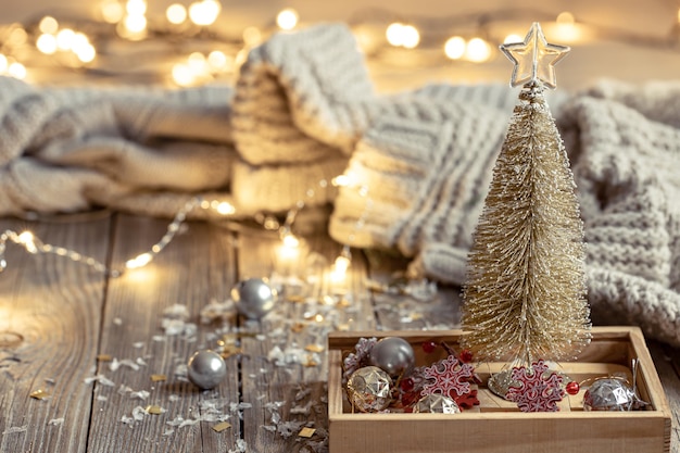 Cozy christmas background with decorative christmas tree and bokeh lights