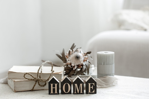 Free photo a cozy composition with details of the interior decor and the decorative word home.