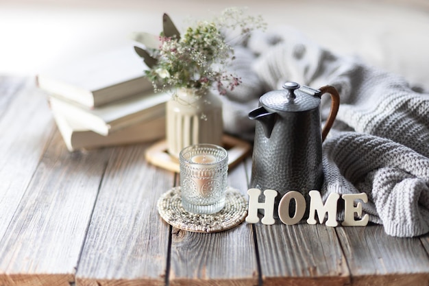 Free photo cozy composition with the inscription home home coziness and comfort