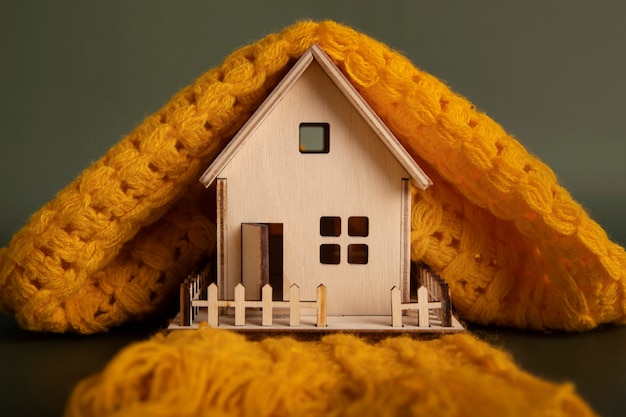 Free photo cozy house concept with wooden toy house