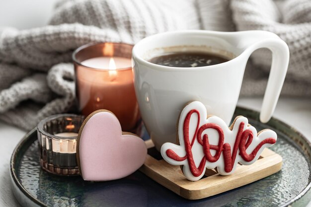 A cozy still life for valentines day with a cup decor details and gingerbread