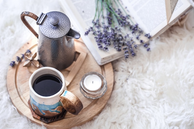 Cozy still life with a kettle and a Cup of hot drink