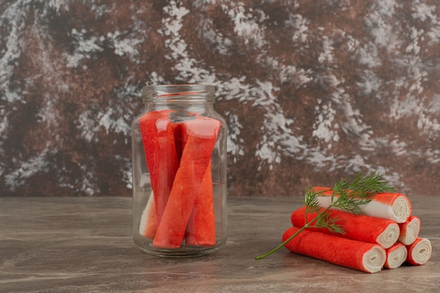 Crab sticks in jar with several crab sticks