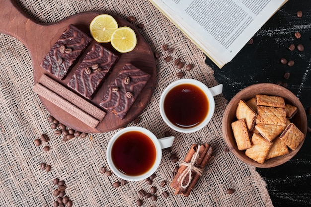 Crackers and chocolate waffles with tea