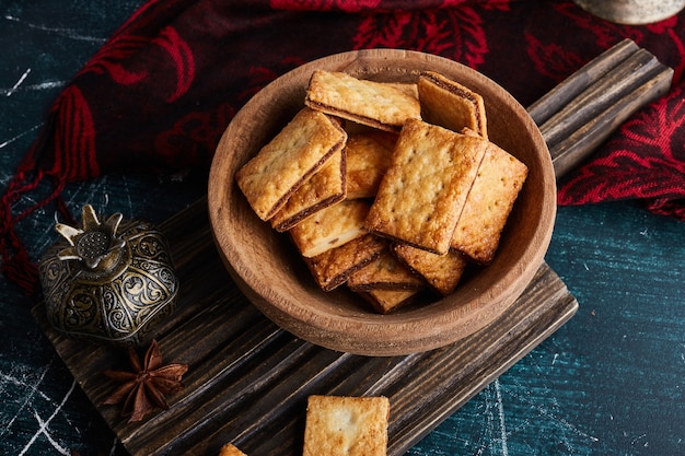 Crackers on a wooden cup. 