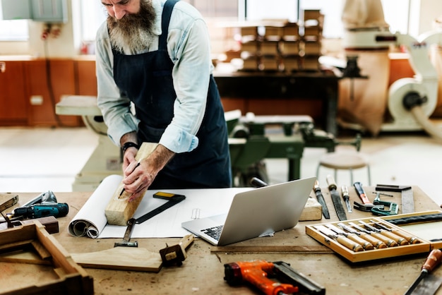 Free Photo craftsman working in a wood shop