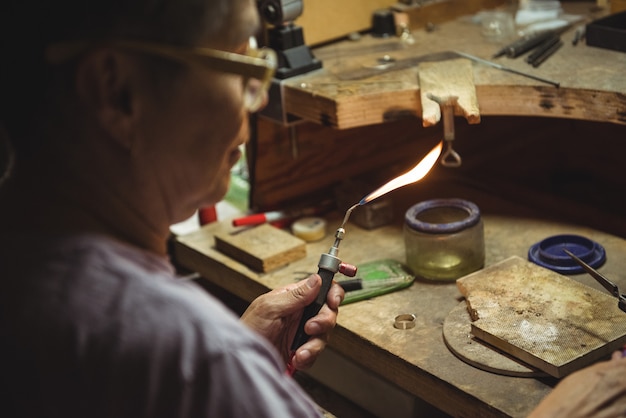 Free Photo craftswoman using blow torch