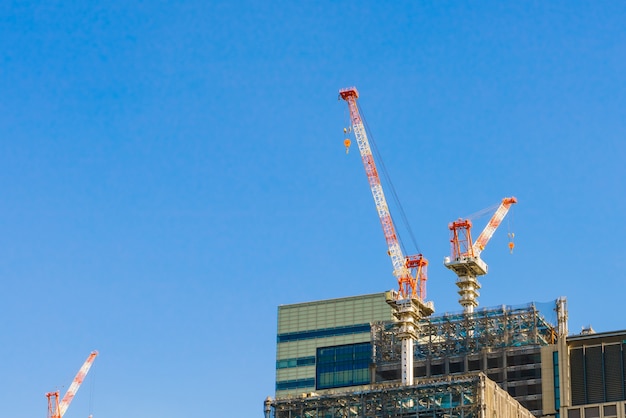 Crane and building construction site